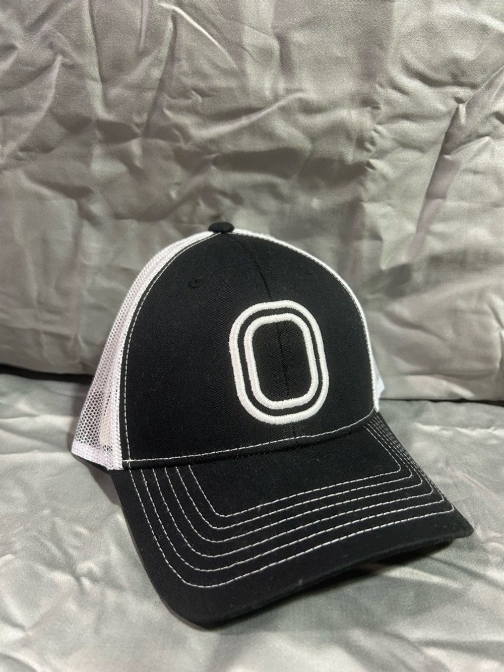 Black and White Mesh Trucker Hat with Embroidered Logo